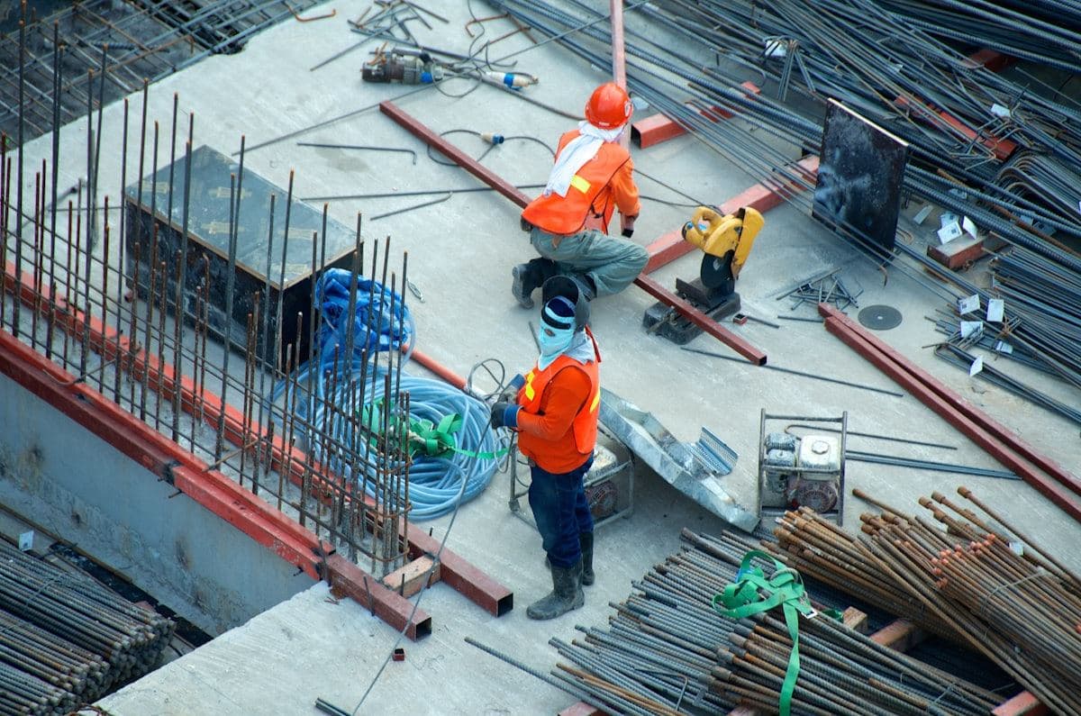 Workers in safety gear on a construction site