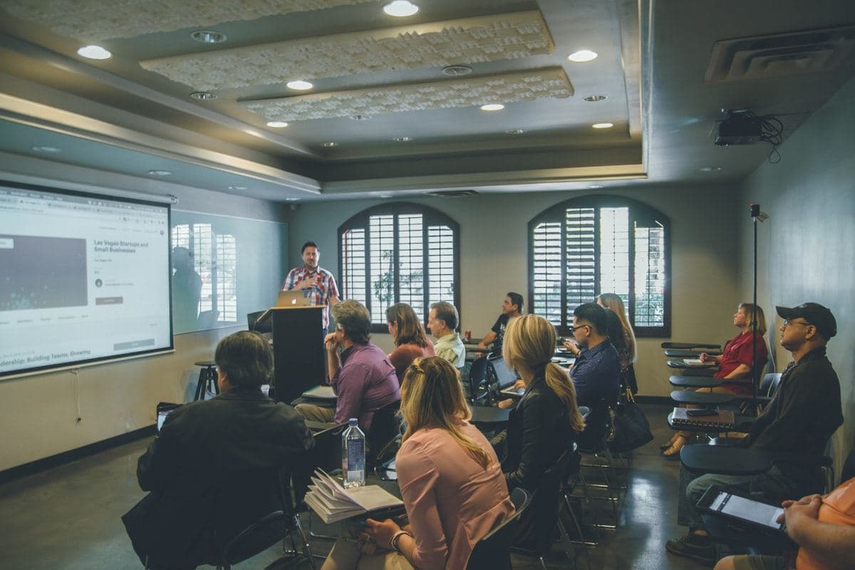 Classroom training session in front of a presentation screen